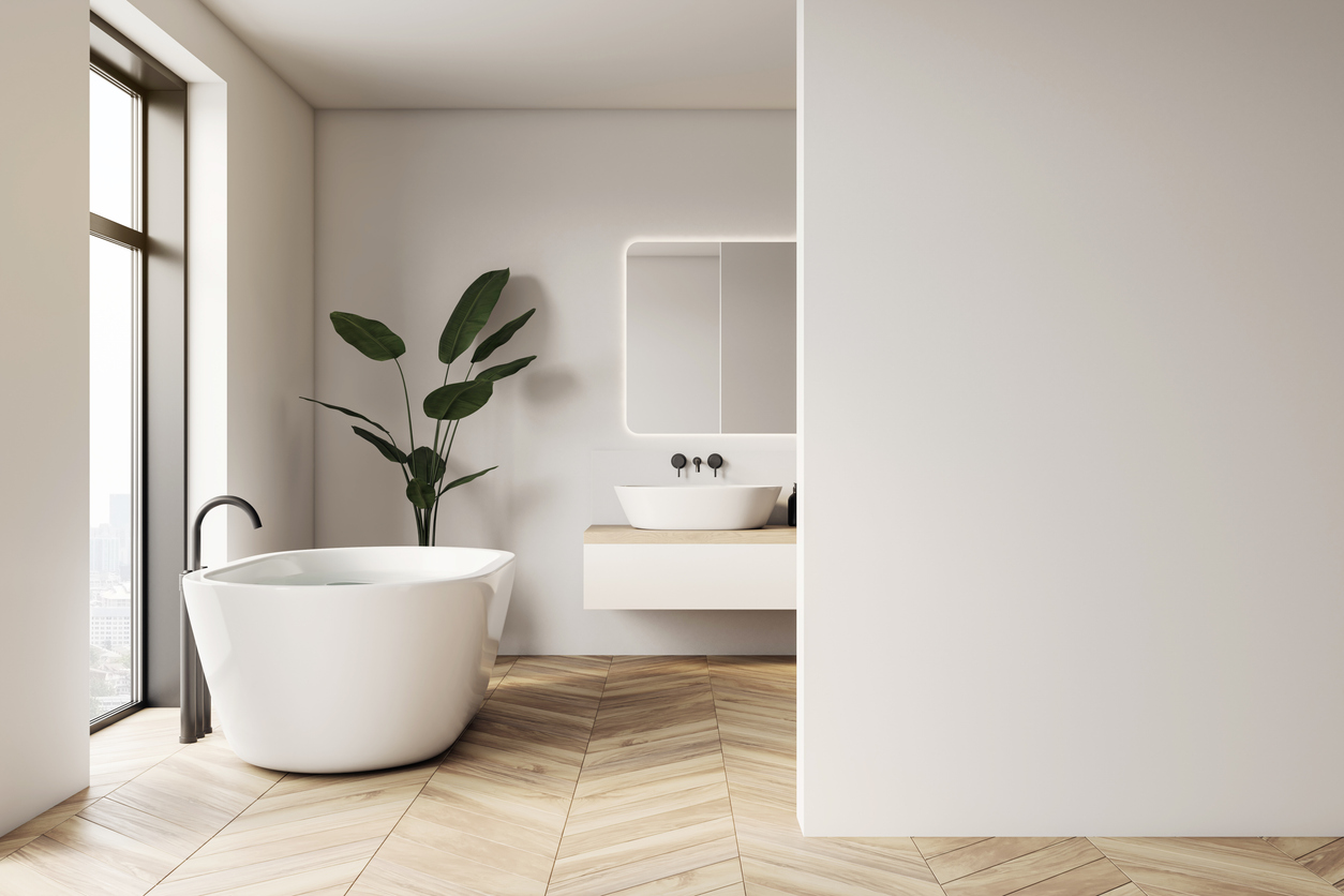 a modern bathroom with herringbone floors