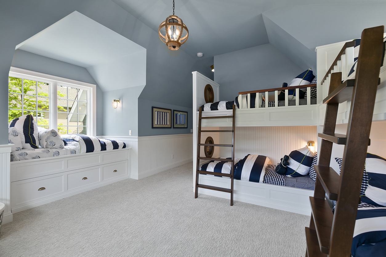 a bedroom with carpets and bunkbeds