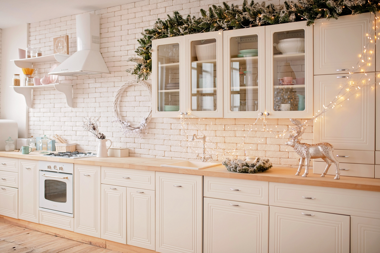 a kitchen with laminate flooring decorated for christmas