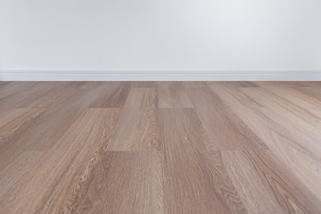 a close up of light brown laminate floors