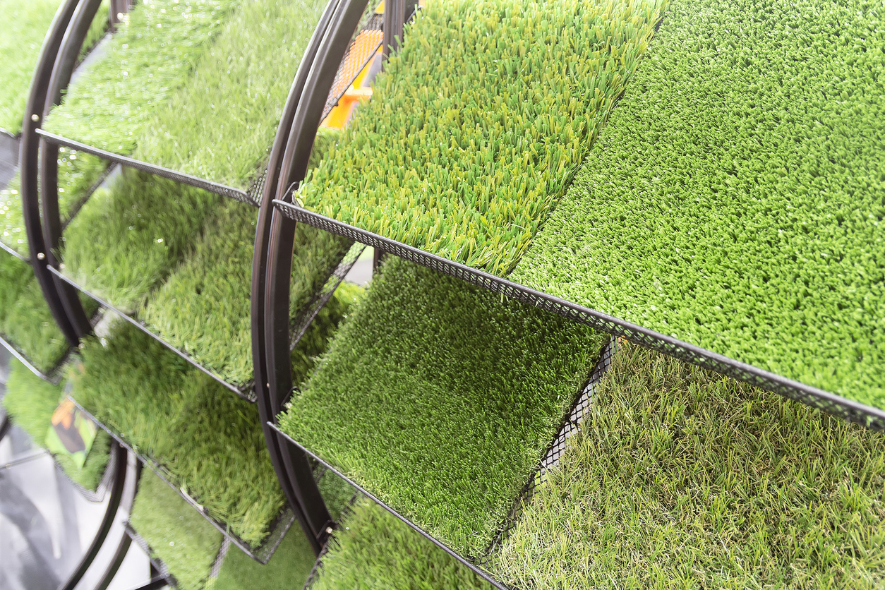 a selection of artificial grass samples on a stand
