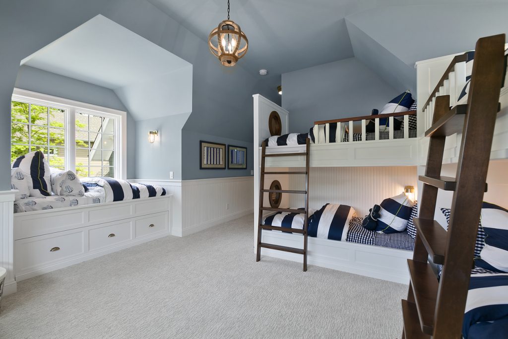 a bedroom with carpets and bunkbeds Carpets Manchester Carpet in a kids’ bedroom with bunk beds