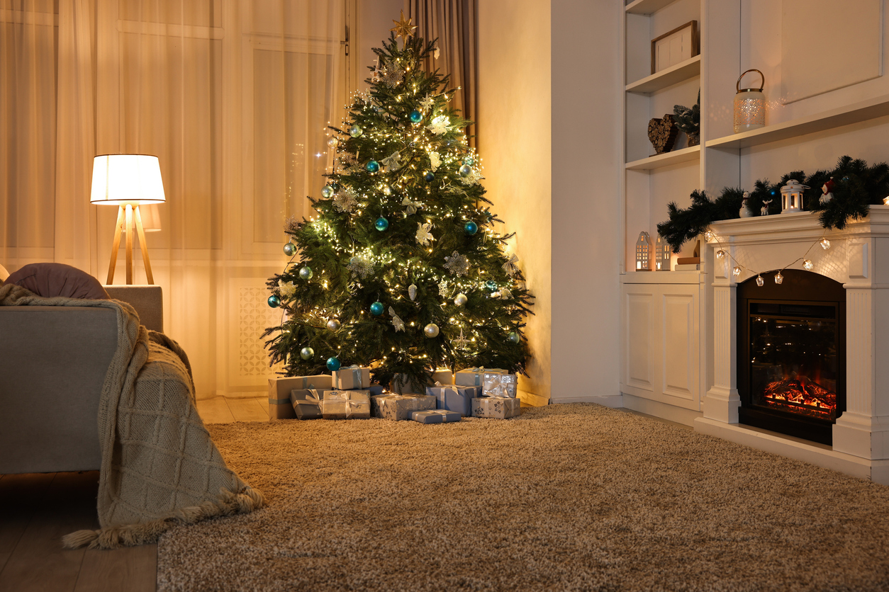 a living room with laminate flooring decorated for christmas