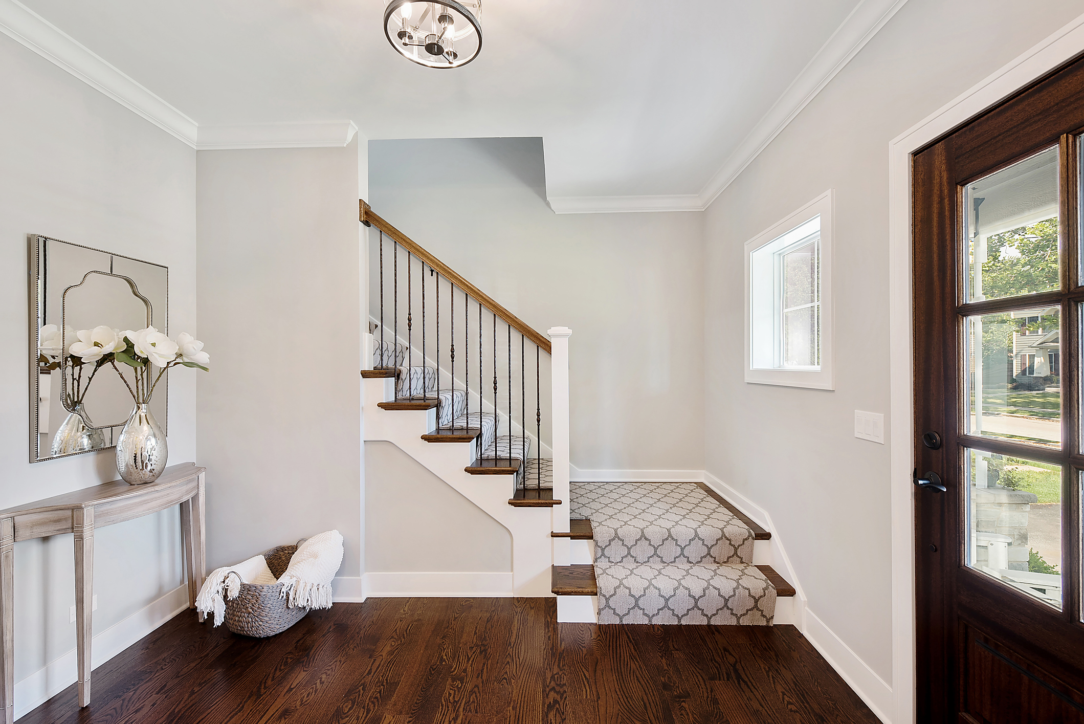 a modern home with a hardwood staircase with a stair runner Best Flooring for Stairs: Comparing Popular Staircase Flooring Ideas a modern home with a hardwood staircase with a stair runner