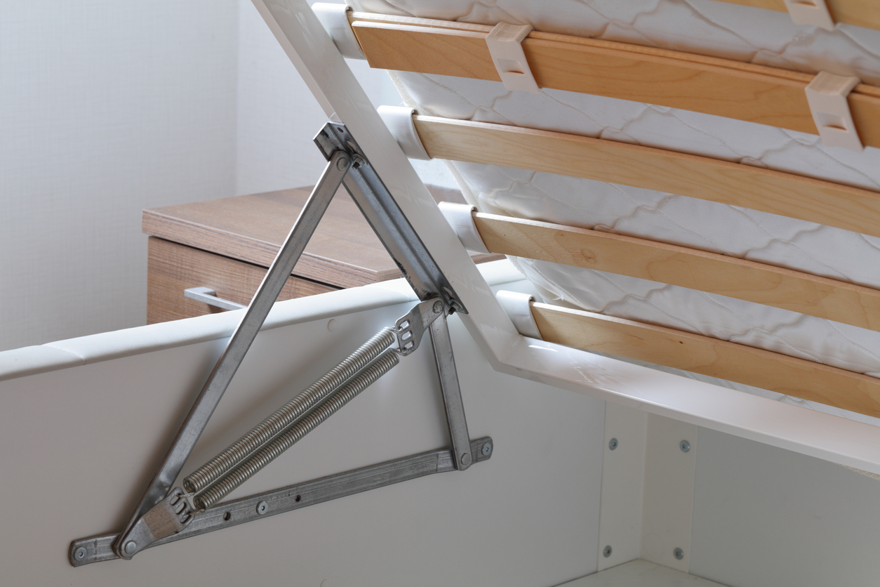 an ottoman bed being lifted at the foot end